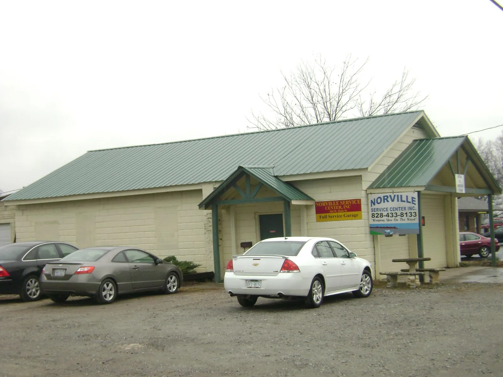 Green metal roof on a service garage with a covered entry in Nevis